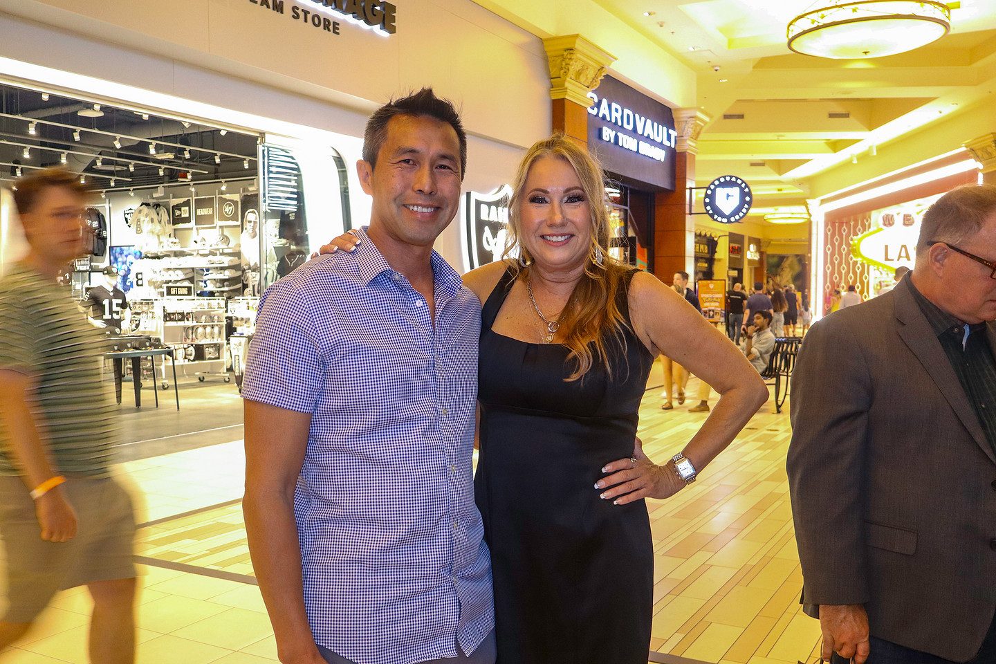 Two guests photographed in the Mandalay Bay concourse on the way to the soirée