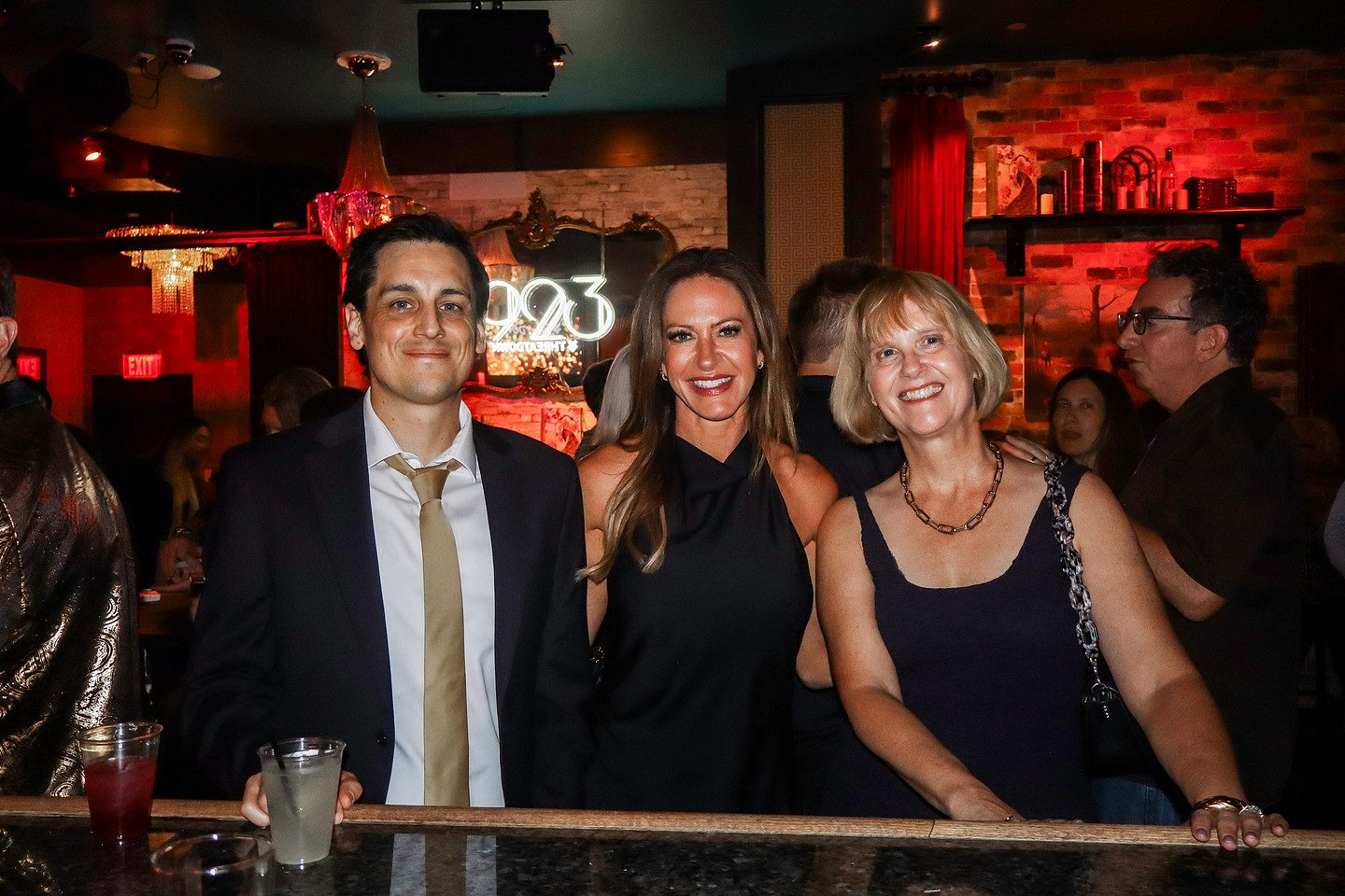 Four guests together at the bar