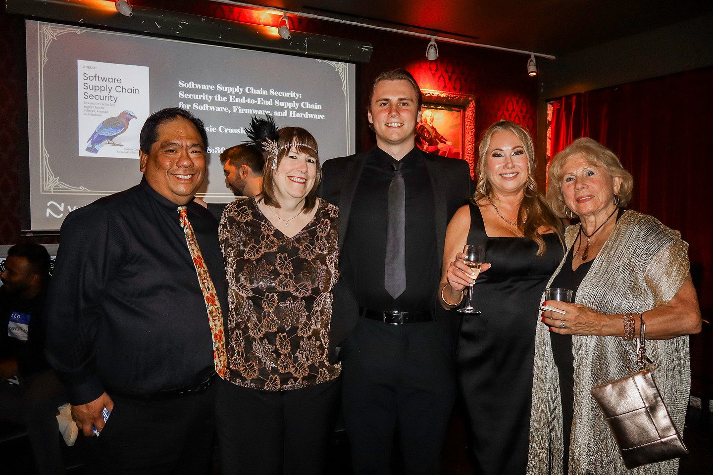 Five guests photographed before the author talk screen